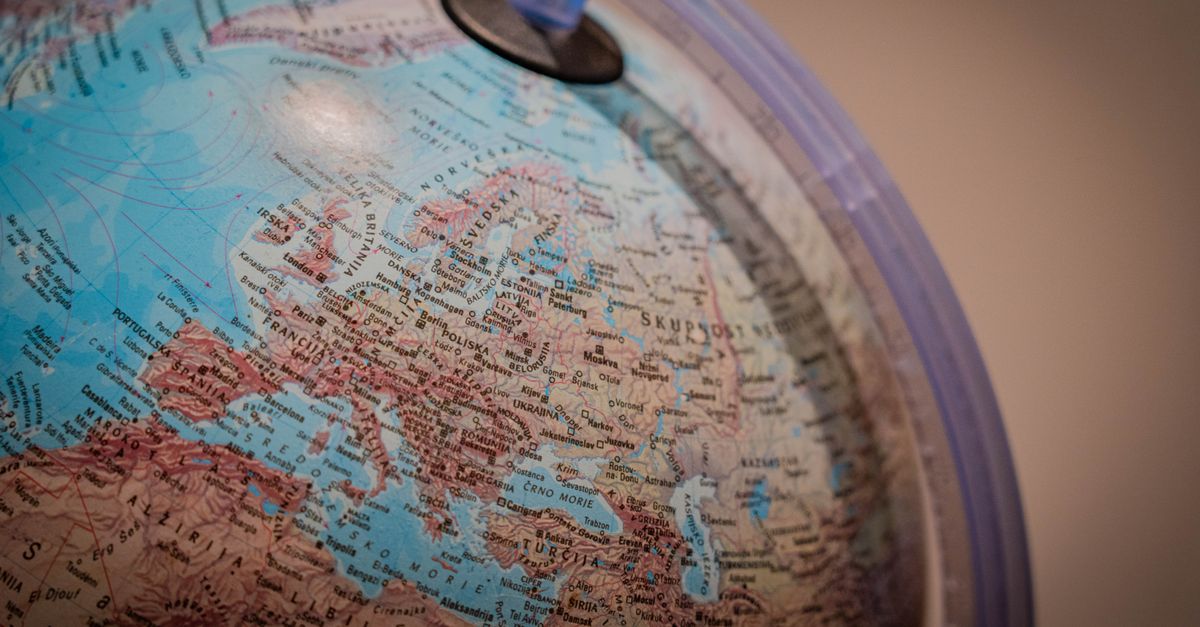 Detailed close-up shot of a world globe displaying European countries for educational purposes.